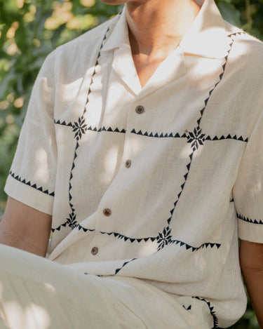 Close of the chequered kala cotton shirt, the cheques embroidered in the suf technique