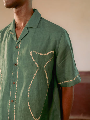 Details of the fish outline in the classy kantha style on a green linen half-sleeved shirt