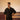 A man in eco-friendly, wild sprigs hand-embroidered linen shirt in a yoga hall. half sleeves shirt, Material: linen, front view